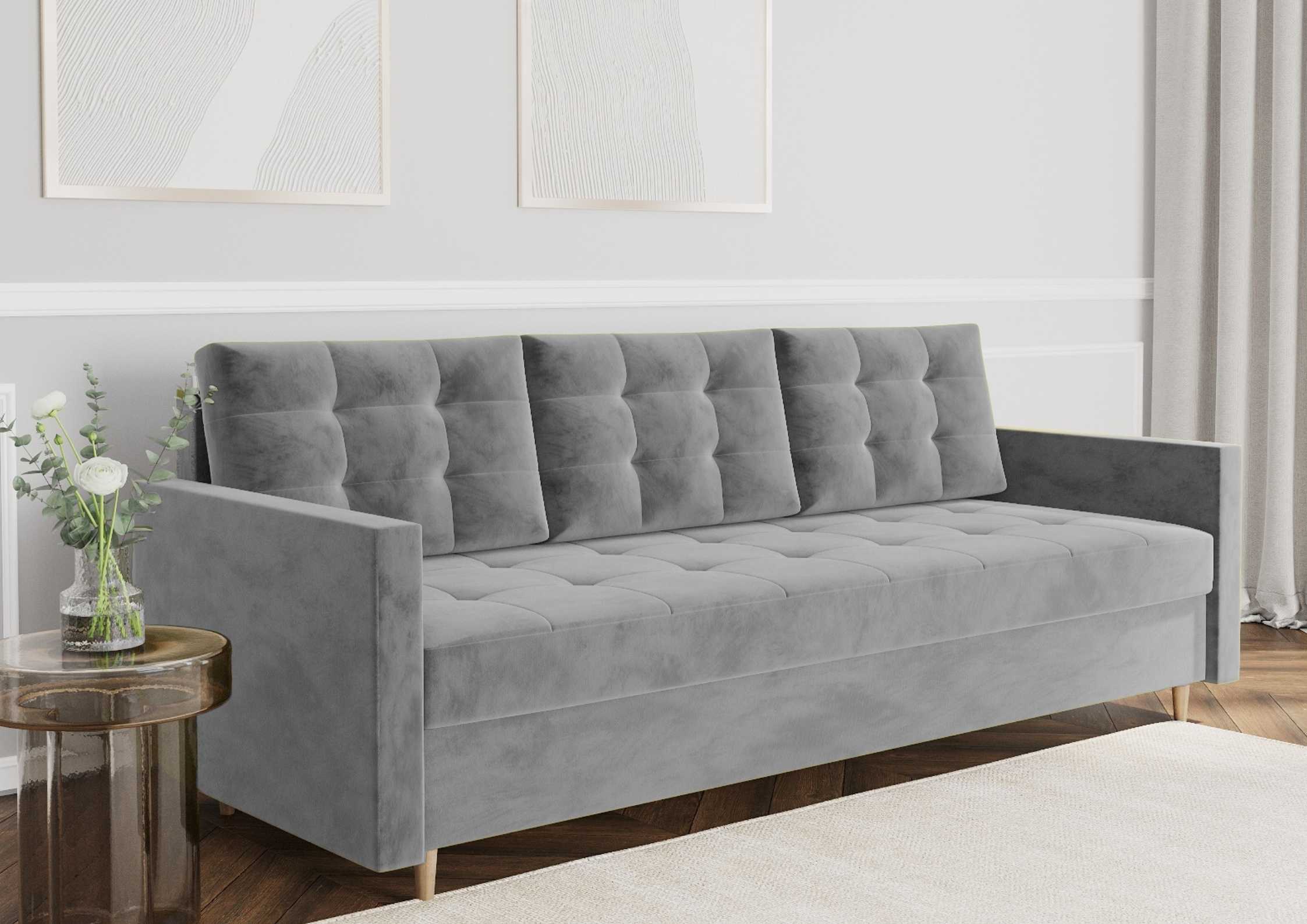 Pikowana sofa z funkcją spania na drewnianych nogach w kolorze szarym